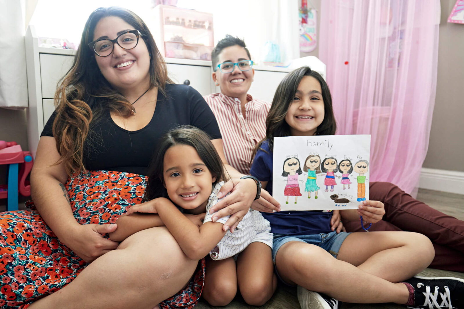 Mothers sitting with their Daughters
